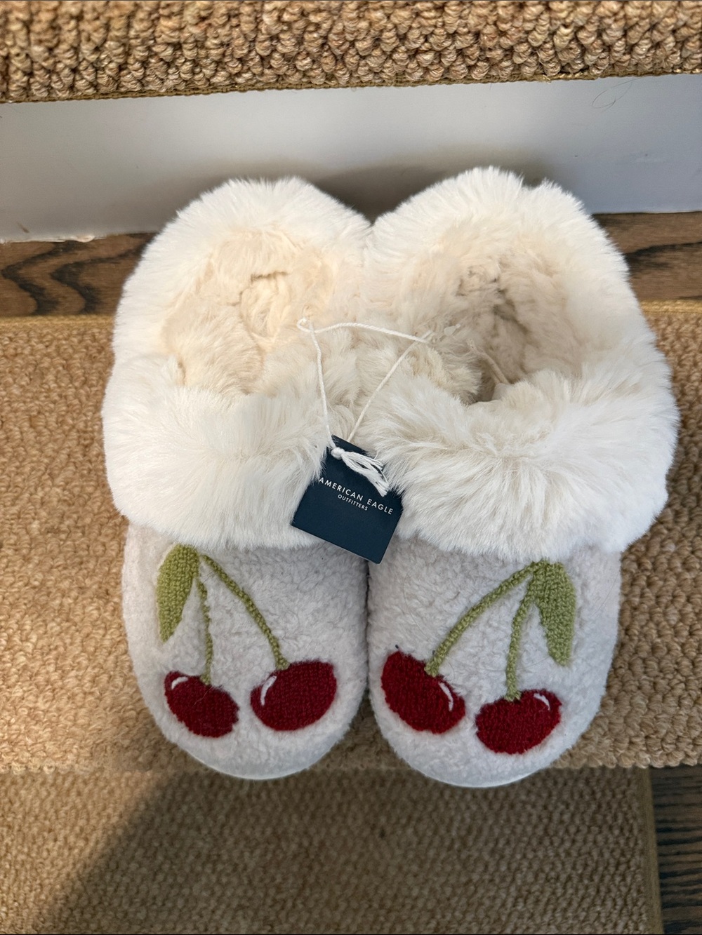 American Eagle Outfitters Cream Fleece Slippers with Red Cherry Detail